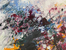 Detail of the abstract painting with expressive brushstrokes and splatters in blue, white, black, red, pink, green, and orange.