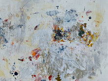 Detail of the abstract textured painting with layered brushstrokes and splatters in off-white, gray, beige, yellow, orange, blue, and black.