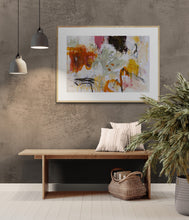 Modern interior with the abstract art, wooden bench, and plants against a textured wall.