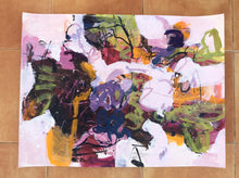 Abstract painting titled "Dancing Hues" in studio setting