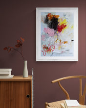 the painting on a wall with a wooden chair and cabinet below