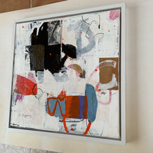 the framed artwork on the studio floor