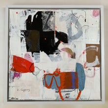the framed artwork on the studio floor