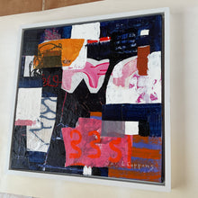 the side of the framed work on the studio floor