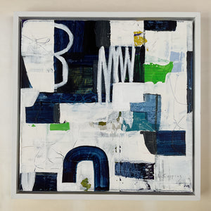 the framed painting on the studio floor