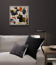 the painting in an interior with a gray sofa with dark pillows in a room with a dark wall
