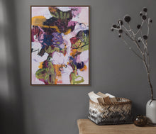 Abstract painting titled "Dancing Hues" in an interior