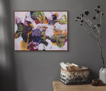 Abstract painting titled "Dancing Hues" in an interior